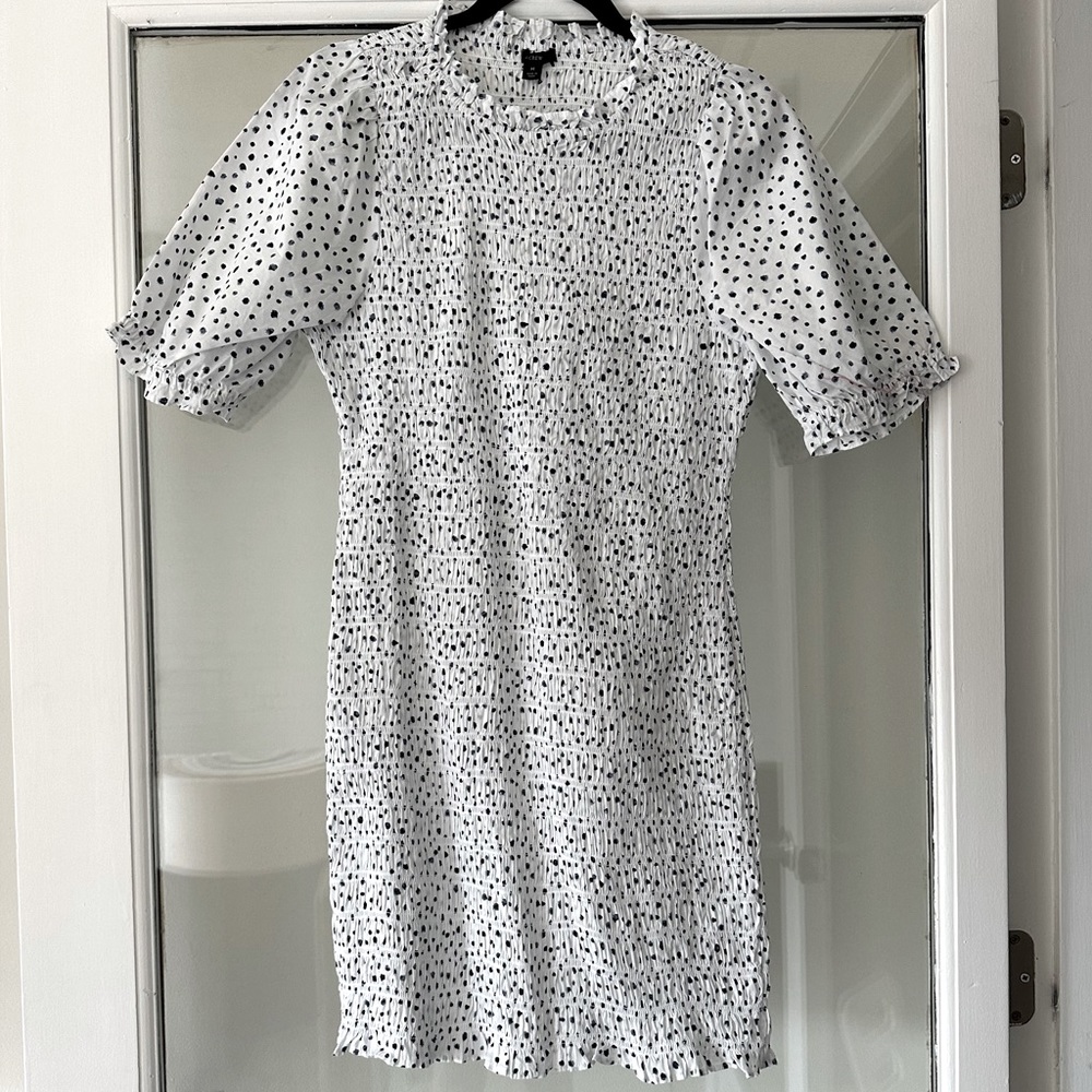JCrew Smocked Blue and White Polkadot dress with small puff sleeves and ruffle